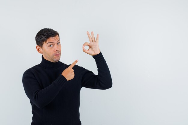 An expressive man is posing in the studio