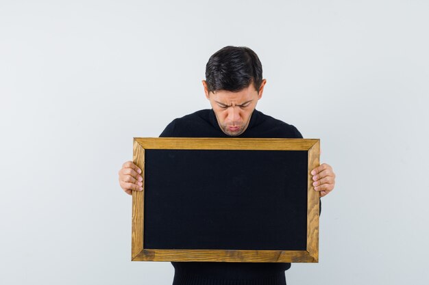 An expressive man is posing in the studio