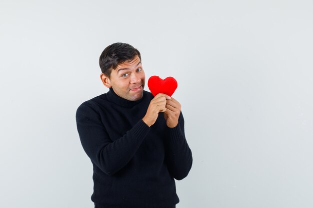 An expressive man is posing in the studio