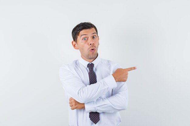 An expressive man is posing in the studio