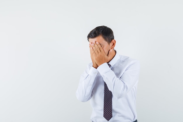 An expressive man is posing in the studio