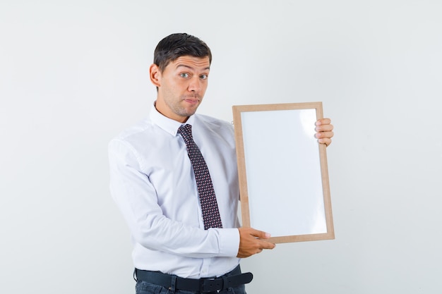 An expressive man is posing in the studio