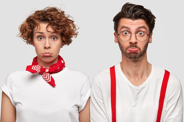 Free Photo expressive man and woman in white t-shirts posing