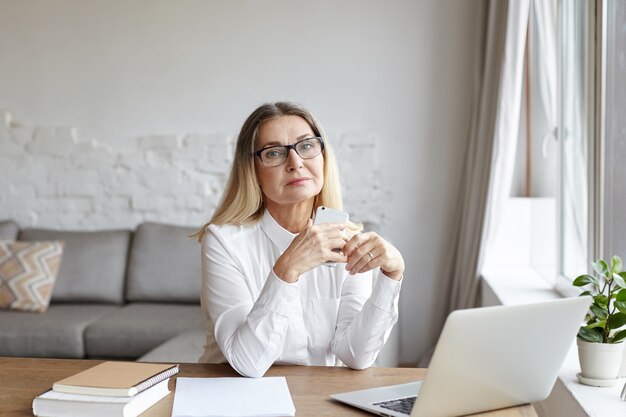 Expressive middle aged woman posing