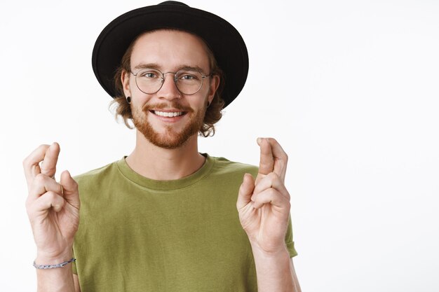 Free Photo expressive redhead bearded man with a hat