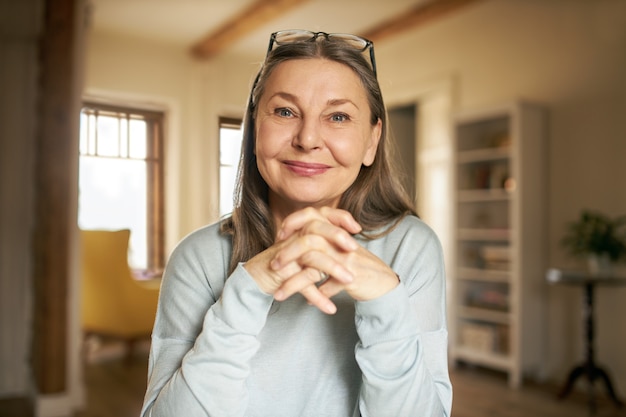 Expressive senior female posing indoor