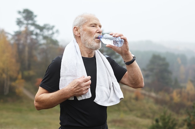 Expressive senior man posing outdoor