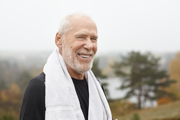 Expressive senior man posing outdoor