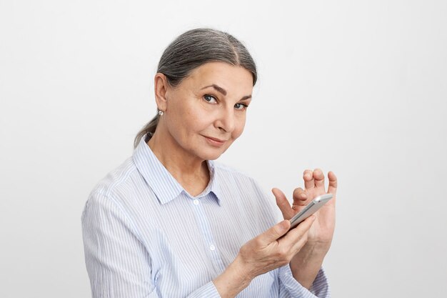 Expressive senior woman posing