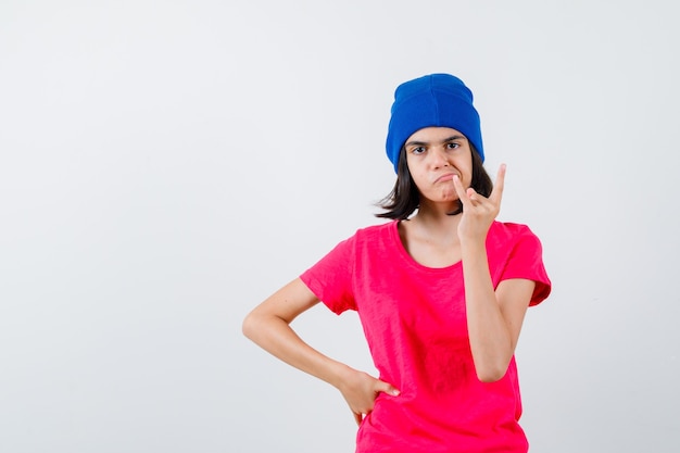 An expressive teenage girl is posing