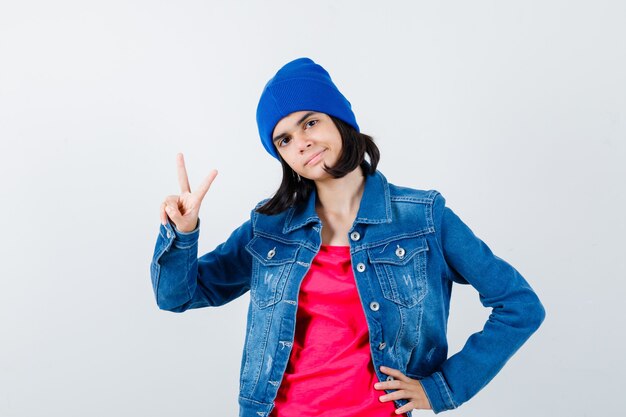 An expressive teenage girl is posing