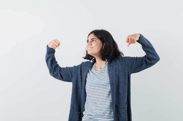 An expressive woman is posing in the studio