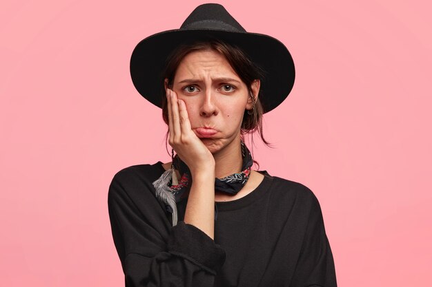 Expressive woman wearing all black clothes