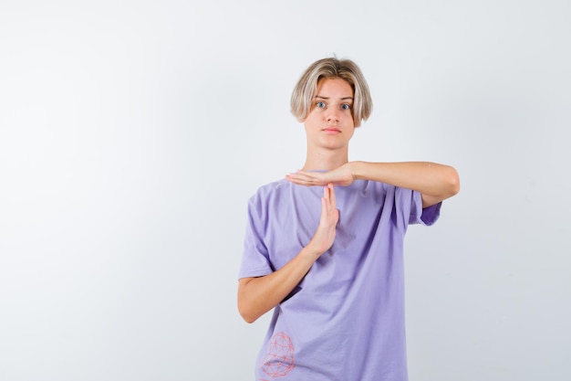 Expressive young boy posing in the studio