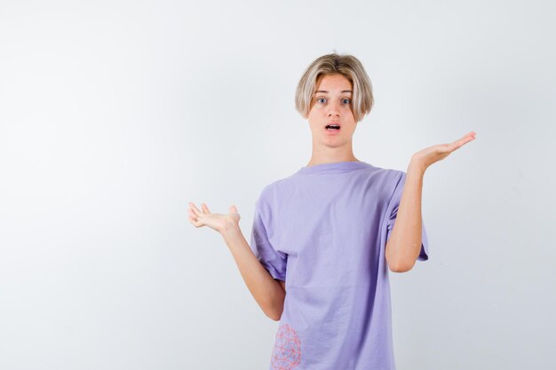 Expressive young boy posing in the studio