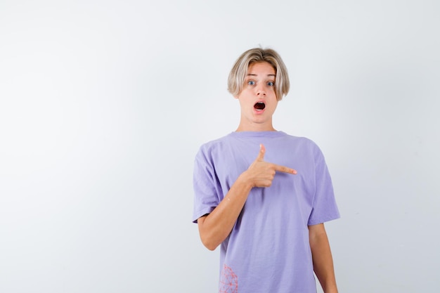 Expressive young boy posing in the studio