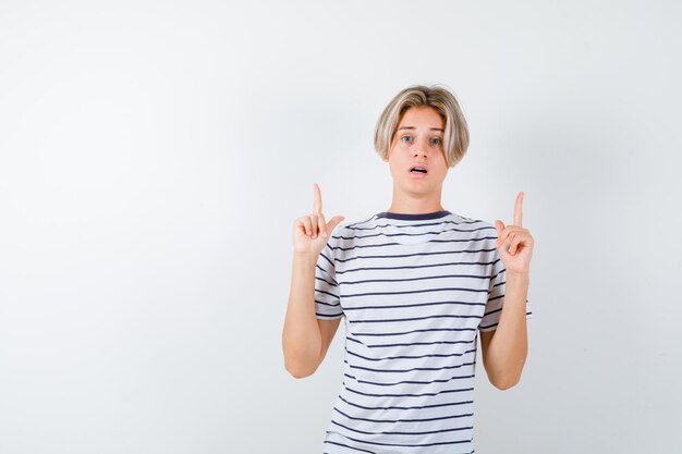 Expressive young boy posing in the studio