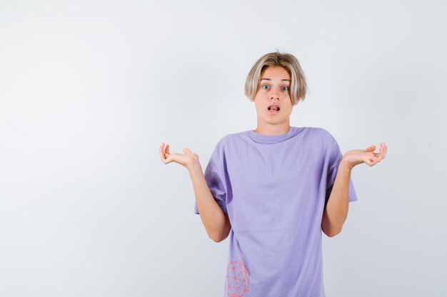 Expressive young boy posing in the studio