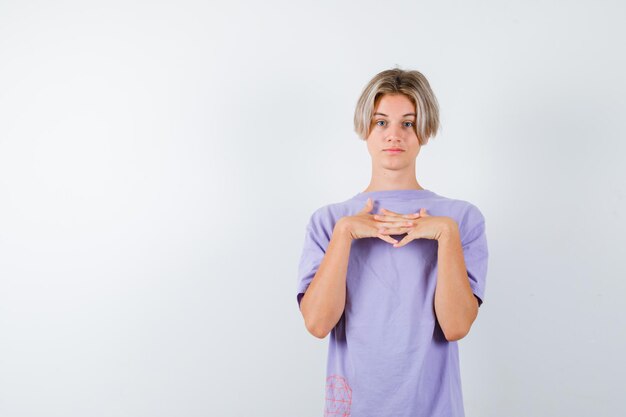 Expressive young boy posing in the studio