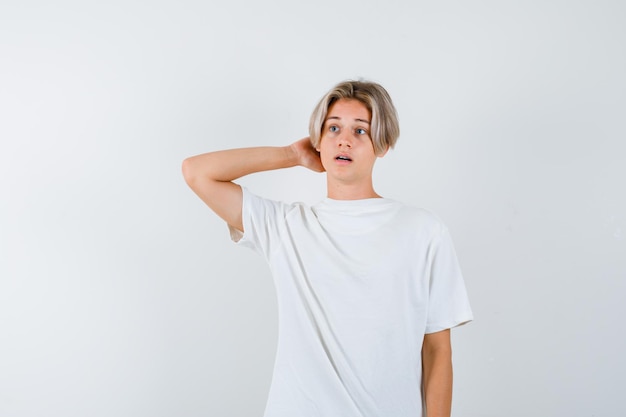 Expressive young boy posing in the studio