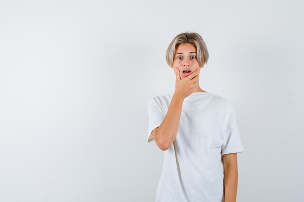 Expressive young boy posing in the studio