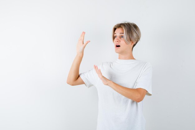 Expressive young boy posing in the studio