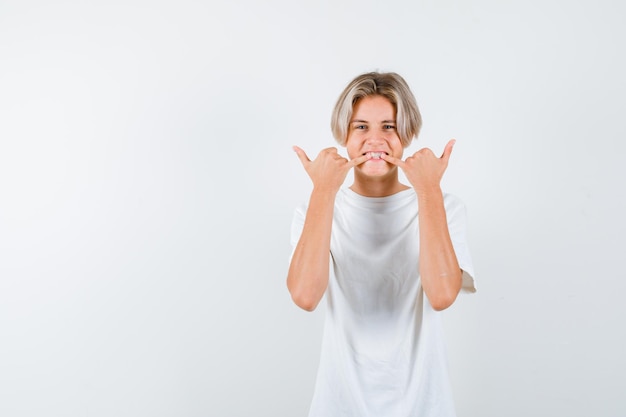 Expressive young boy posing in the studio