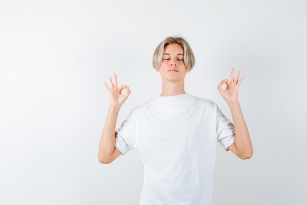 Expressive young boy posing in the studio