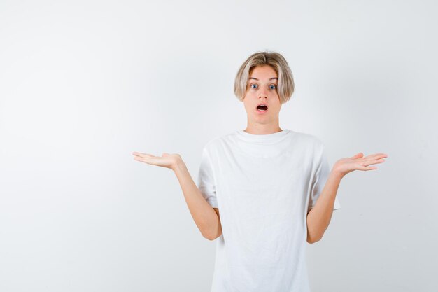 Expressive young boy posing in the studio