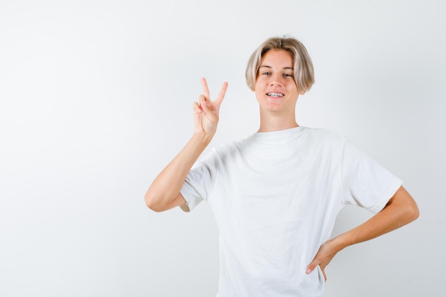 Expressive young boy posing in the studio