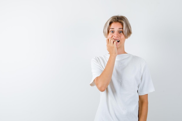 Expressive young boy posing in the studio