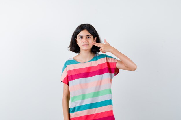 Expressive young girl posing in the studio