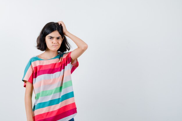 Expressive young girl posing in the studio