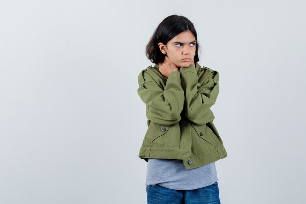 Expressive young girl posing in the studio