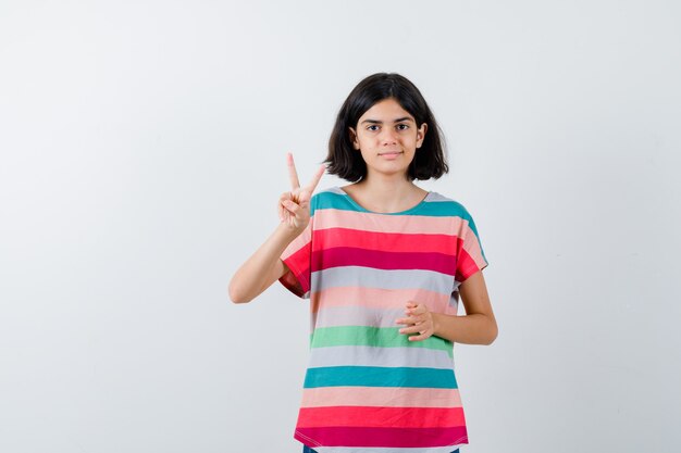 Expressive young girl posing in the studio