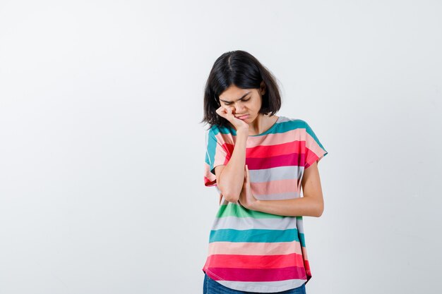 Expressive young girl posing in the studio