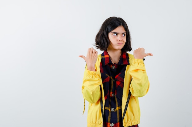 Expressive young girl posing in the studio