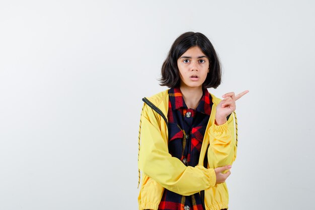 Expressive young girl posing in the studio