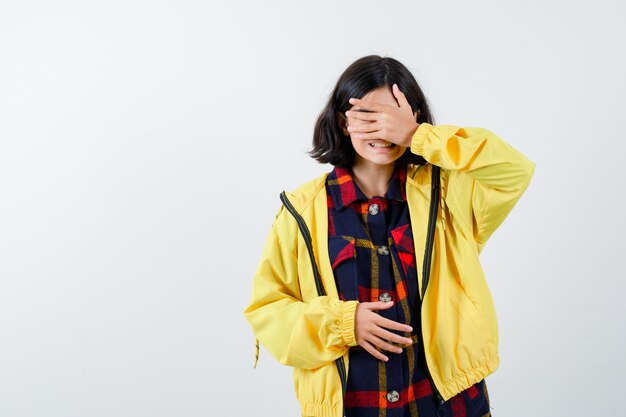 Expressive young girl posing in the studio