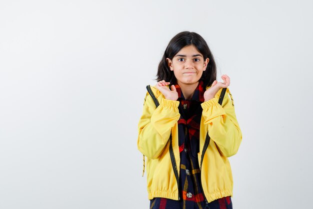 Expressive young girl posing in the studio