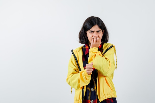 Expressive young girl posing in the studio