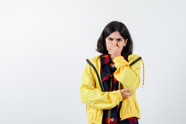 Expressive young girl posing in the studio