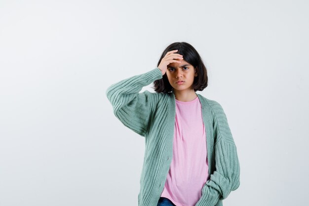 Expressive young girl posing in the studio