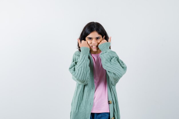 Expressive young girl posing in the studio