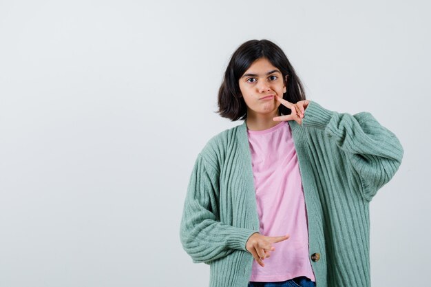 Expressive young girl posing in the studio