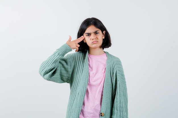 Expressive young girl posing in the studio