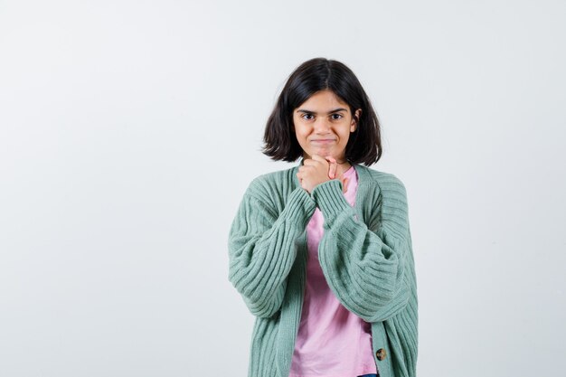 Expressive young girl posing in the studio