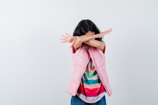 Expressive young girl posing in the studio