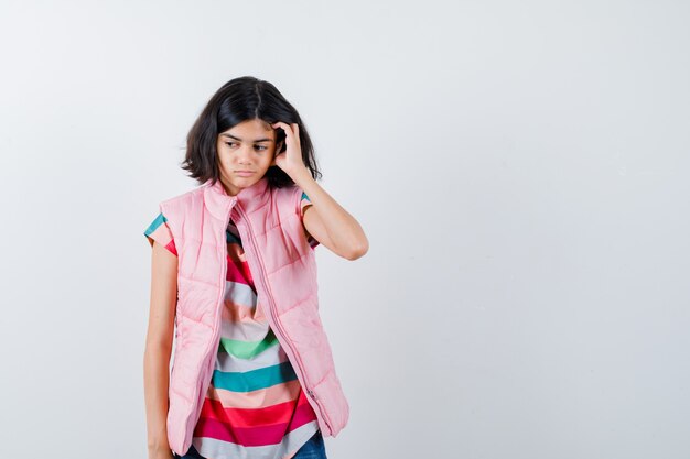 Expressive young girl posing in the studio