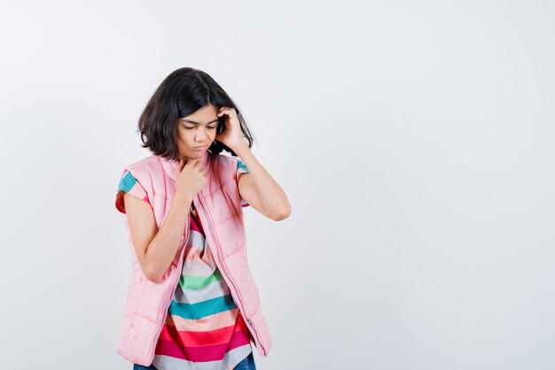 Expressive young girl posing in the studio